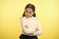 That is not fair. Pupil not agree with mark. Girl serious face offended yellow background. Kid unhappy looks strictly Royalty Free Stock Photo