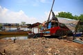 Fishing boats that are sitting on the shore,