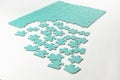 Not fully assembled puzzle in blue on a light background