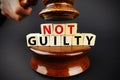 Not guilty verdict or court decision with judge gavel on dark background Royalty Free Stock Photo