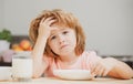 Not hungry. Kid refusing to eat. Child have no appetite. Upset little kid refuse to eat organic cereals with milk. Child Royalty Free Stock Photo