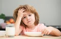 Not hungry. Kid refusing to eat. Child have no appetite. Upset little kid refuse to eat organic cereals with milk. Child Royalty Free Stock Photo