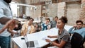 We are not just a team. Group of multicultural team listening carefully to their team leader while having business Royalty Free Stock Photo