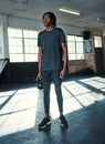 Not letting anything stand in my way of my fitness. a young man lifting kettlebells in a gym. Royalty Free Stock Photo