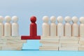 Not like everyone. Business risk. Leadership and superiority. People figures on bridge, one red person miniature on gap Royalty Free Stock Photo