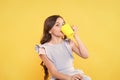 Not my cup of tea. Making sip. Drink enough water. Girl kid hold mug yellow background. Lovely child hold mug. Drinking Royalty Free Stock Photo