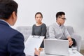 It is not my fault! Displeased young man talking to psychiatrist and gesturing while his wife sitting near him and keeping arms Royalty Free Stock Photo