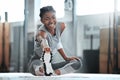 Not scorned or covered in scars. Portrait of a young beautiful woman doing stretches and exercising at the gym. Royalty Free Stock Photo