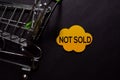 Not Sold write on sticky note isolated on black table Royalty Free Stock Photo