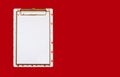 Not a standard notepad with a white paper clip on a red background Royalty Free Stock Photo