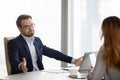 Not sure doubtful businessman at meeting with partners