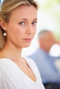 Not sure if she should stay or go... - Marital problems. Serious mature woman looking worried with her husband in the