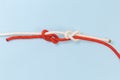 Not tightened rope fisherman knot on a blue background Royalty Free Stock Photo