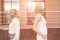 Not touch people in mask portrait. New normal. Corona virus safety. Two women