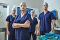 Not for the weak, this aint no 9 to 5. Portrait of a team of surgeons in a hospital.