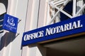 Notaire french office entrance board blue sign logo notary in building