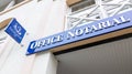 Notaire french office notarial entrance board blue sign text and logo notary agency