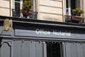 Notaire french office notarial entrance facade sign text and plate logo notary agency