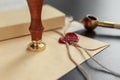 Notarial wax seal on tied scrolled documents, closeup