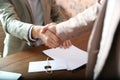 Notary and client shaking hands in office, closeup Royalty Free Stock Photo