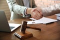 Notary and client shaking hands in office, closeup Royalty Free Stock Photo