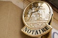 Notary golden board sign gold logo entrance building office for french Notaire