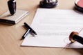 Notary pen lying on testament. Royalty Free Stock Photo