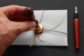 Notary public wax stamper. White envelope with brown wax seal, golden stamp. Responsive design mockup, flat lay. Still life with