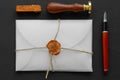 Notary public wax stamper. White envelope with brown wax seal, golden stamp. Responsive design mockup, flat lay. Still life with