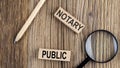 NOTARY PUBLIC words on wooden building blocks on the wooden background Royalty Free Stock Photo