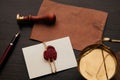 Notary stamp, scale and envelope with wax seal on a wooden table. Notary tools Royalty Free Stock Photo