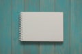 Note book on blue wooden desk. Royalty Free Stock Photo