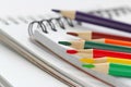 Note book and colored pencils Royalty Free Stock Photo