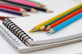 Note book and colored pencils Royalty Free Stock Photo