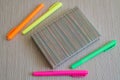 Note book and four colored Markers. Royalty Free Stock Photo