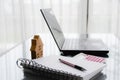Note book, a pen, calculator, home model and notebook on desk, work place Royalty Free Stock Photo