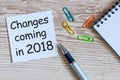 A note Changes coming in 2018. With office or school supplies