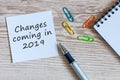 A note Changes coming in 2019. With office or school supplies Royalty Free Stock Photo
