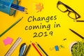 A note Changes coming in 2019. With office or school supplies Royalty Free Stock Photo