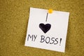 Note with i LOVE MY Boss. Sticky note with inscription pinned on a cork bulletin board