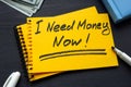 A note I need money now in a notebook about a loan. Royalty Free Stock Photo