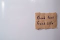 Note labeled with sign good food good life attached to the refrigerator door Royalty Free Stock Photo