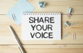 message of share your voice, with desk background Royalty Free Stock Photo