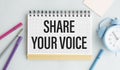 message of share your voice, with desk background Royalty Free Stock Photo