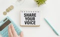message of share your voice, with desk background Royalty Free Stock Photo