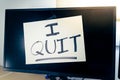 Note on a monitor of a work computer with the text I QUIT. Great resignation concept