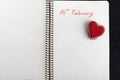 Note on notebook: 14 FEBRUARY and heart-shaped cookies. Valentine Day Royalty Free Stock Photo