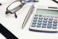 Note pad, pen, glasses and pocket calculator Royalty Free Stock Photo