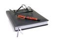 Note Pad with Pen and Specks Royalty Free Stock Photo