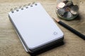 Note pad, pencil and coins Royalty Free Stock Photo